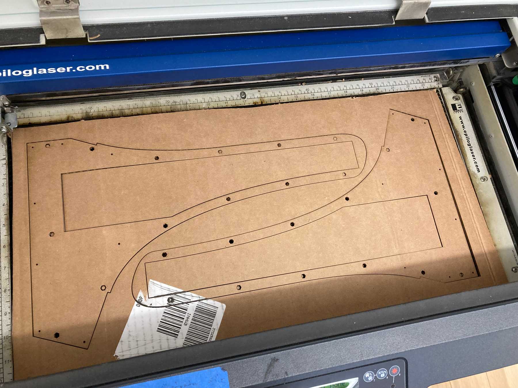 Laser-cutting the new design in cardboard