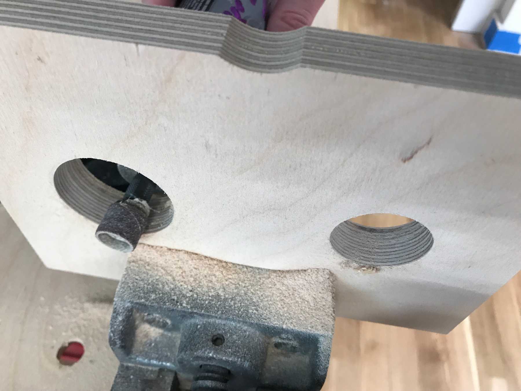 Using the dremel to widen the holes