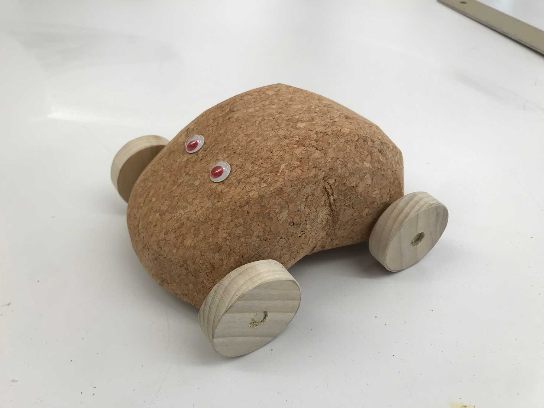 A toy car made of cork and wood