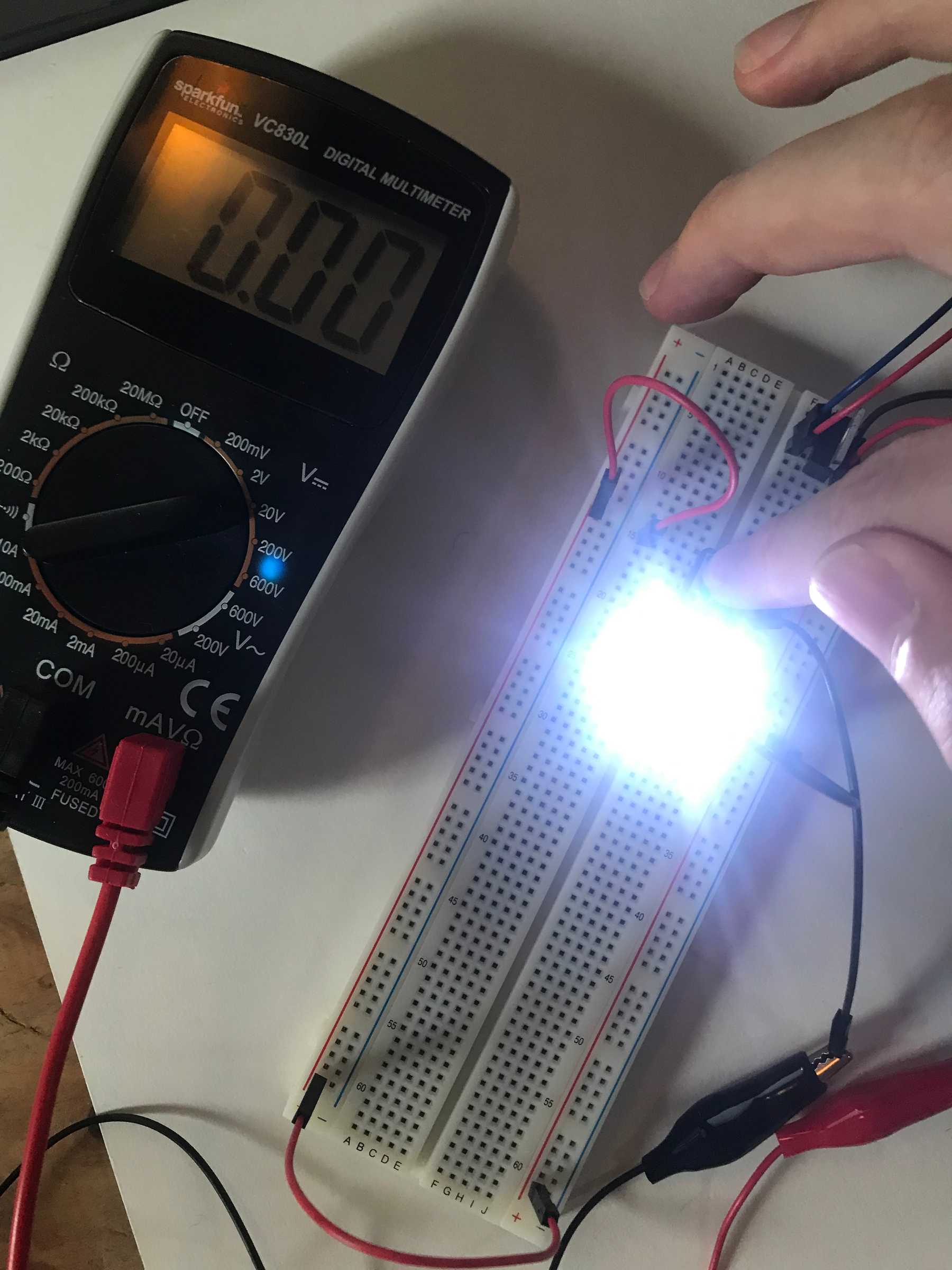 Measuring the voltage drop across the pressed button